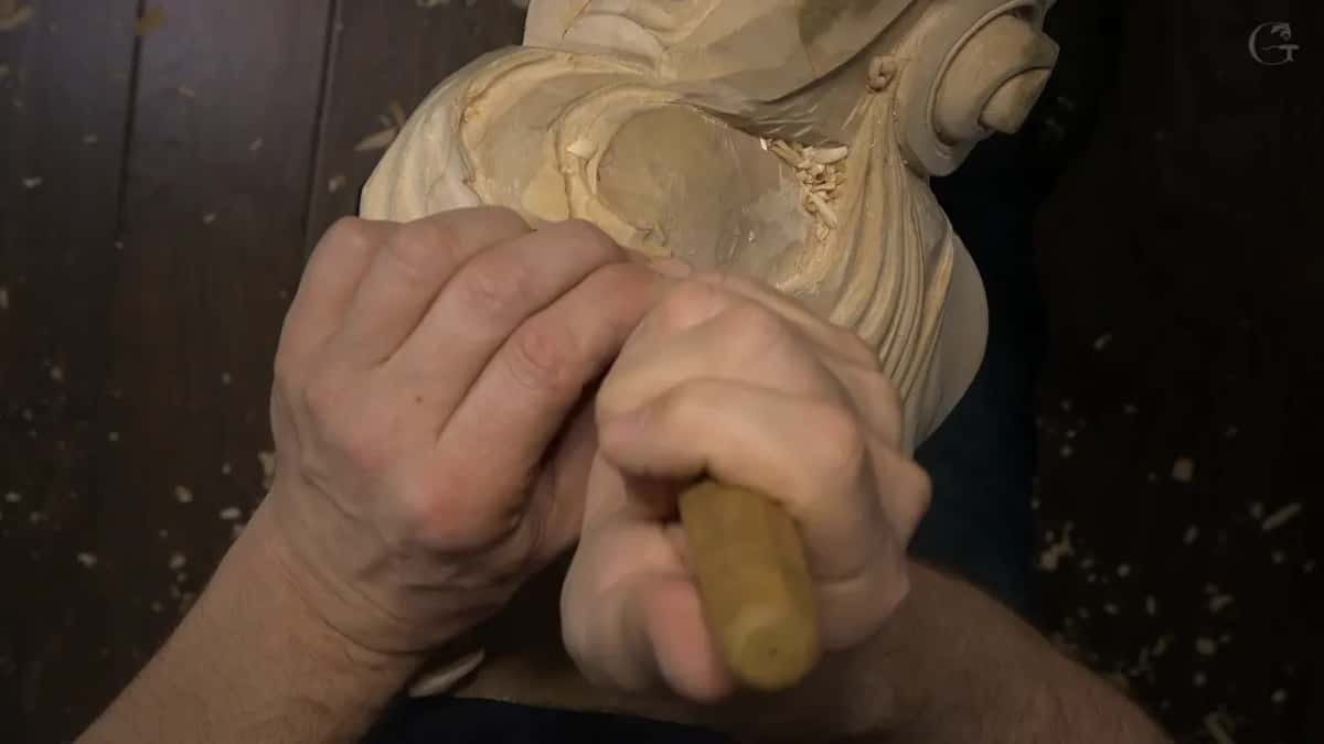 Short handle, pushed with the palm into a curve.