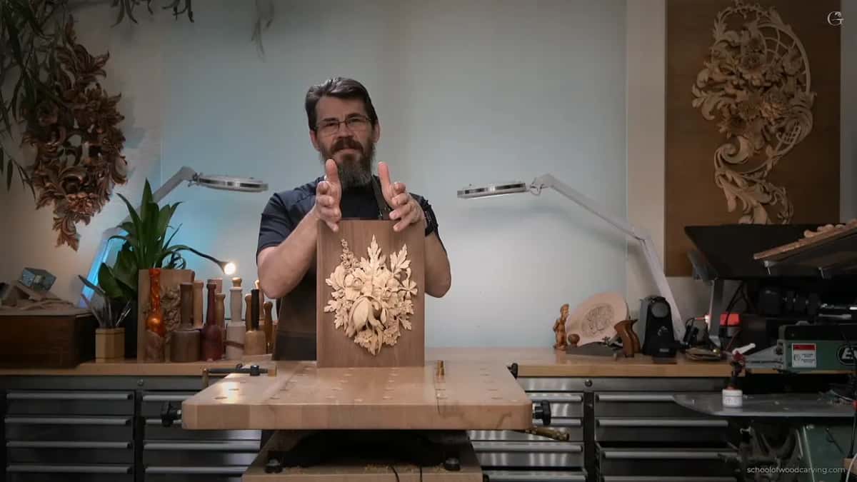 Hands spread wide beside the upright panel