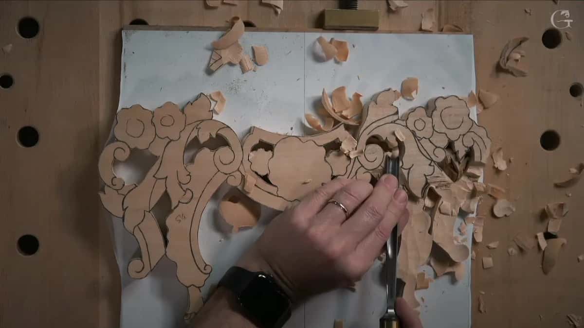 Outlining a scroll with the gouge held a hair off the drawn line