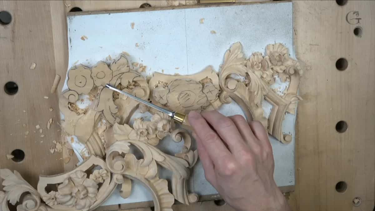 One leaf drawn to pass over where its twin on the first panel passed under, which is a deliberate difference between the pair