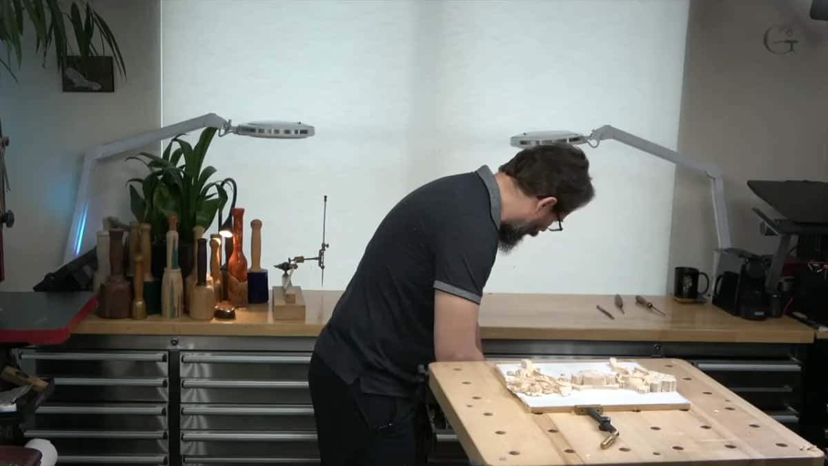 Tools going back into their drawers, because a bench covered in gouges is a bench where he starts losing things