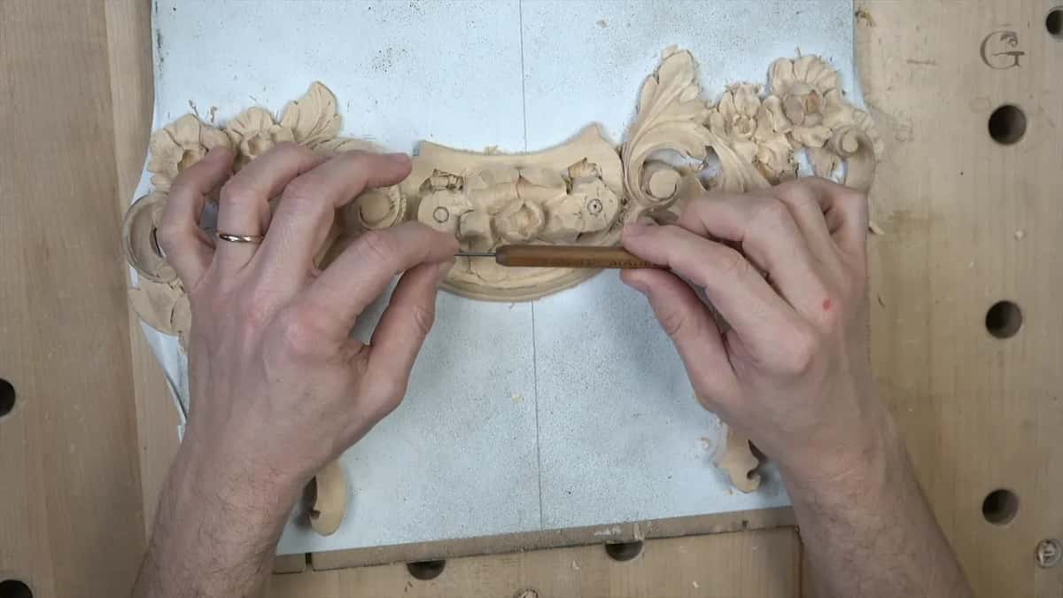 Slim Dockyard gouge held across the carving, marked 1.5 millimetres though it measures under that