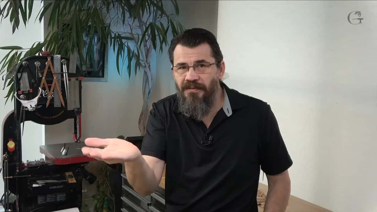 Open hand held out to camera while he describes the movement, flat first and then turning