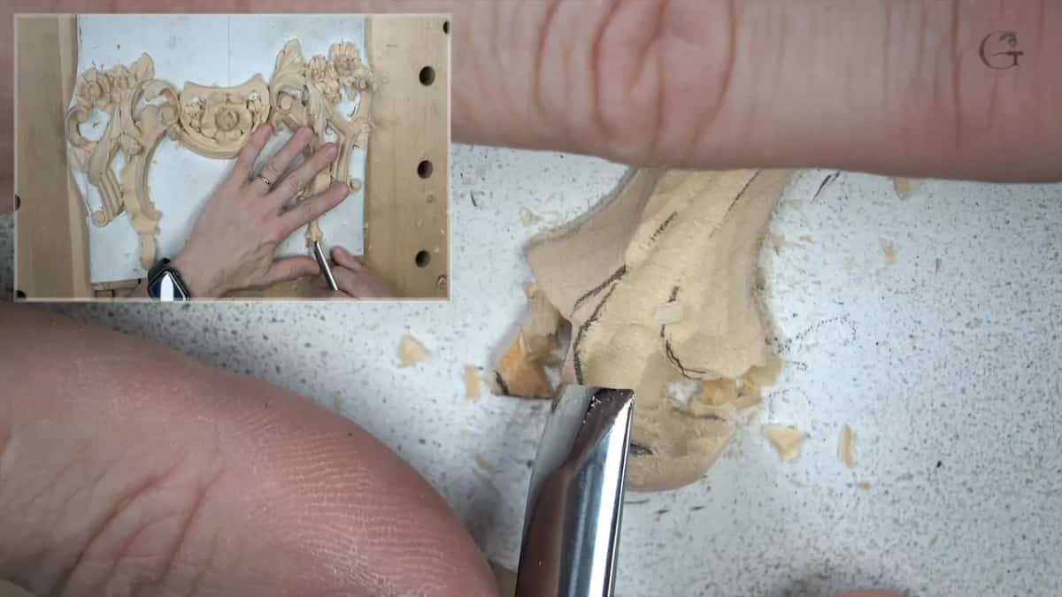 Gouge cutting into the curled end of the detail