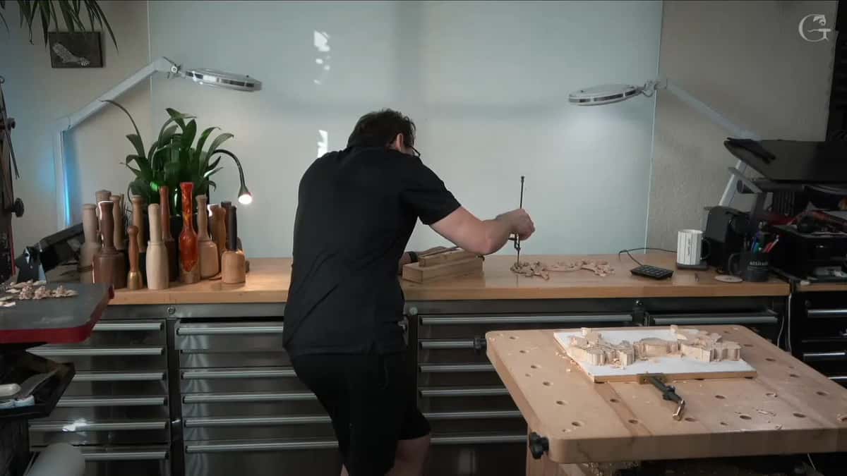 Measuring arm set against the finished panel to read a height off it