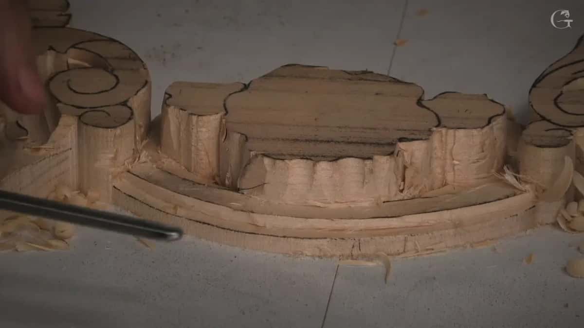 Molding channel worked down along the edge of the ornament