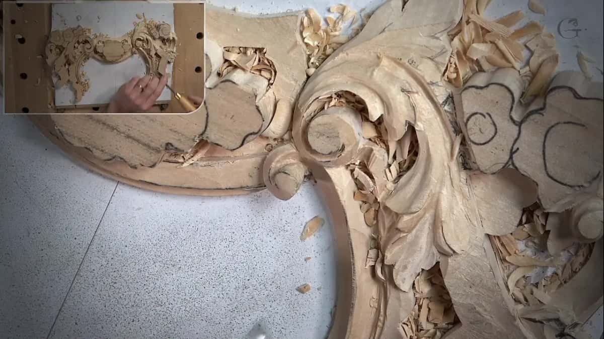 Fishtail gouge turned upside down and drawn in a slicing motion to start the undercut beneath the leaf