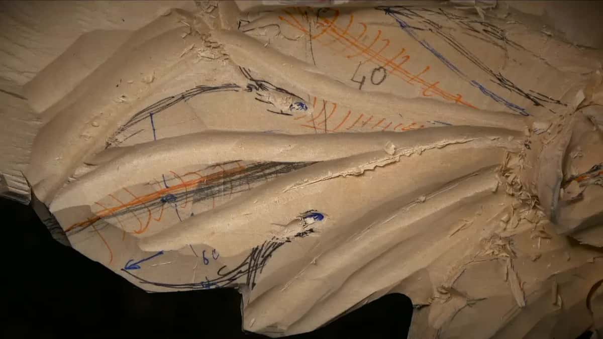 Numbers 40 and 60 written on the leaf in pen, beside blue and orange guide lines