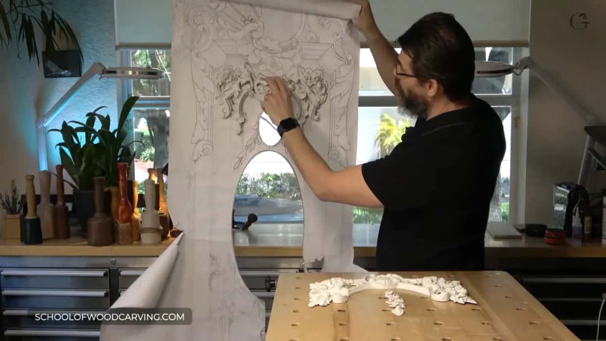 Painted piece held against its place on the full size drawing