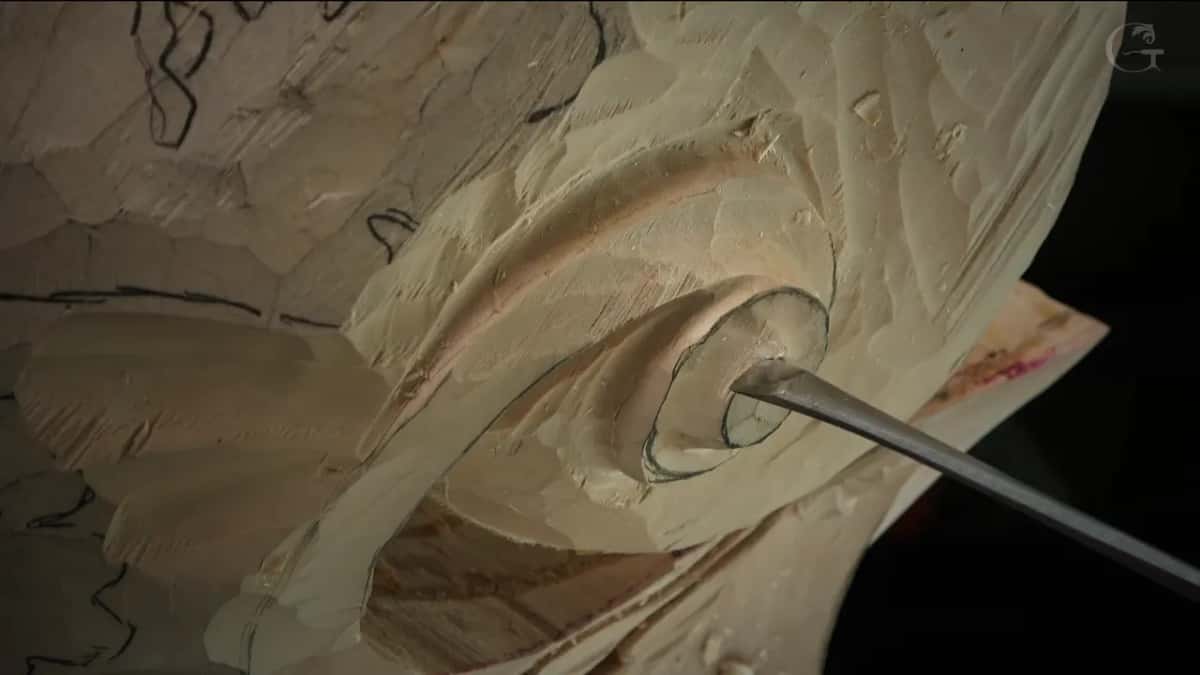 Long gouge set into the eye of the volute