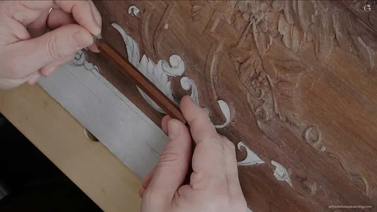 A long dark handled micro gouge held up, with no marking on the shank at all.