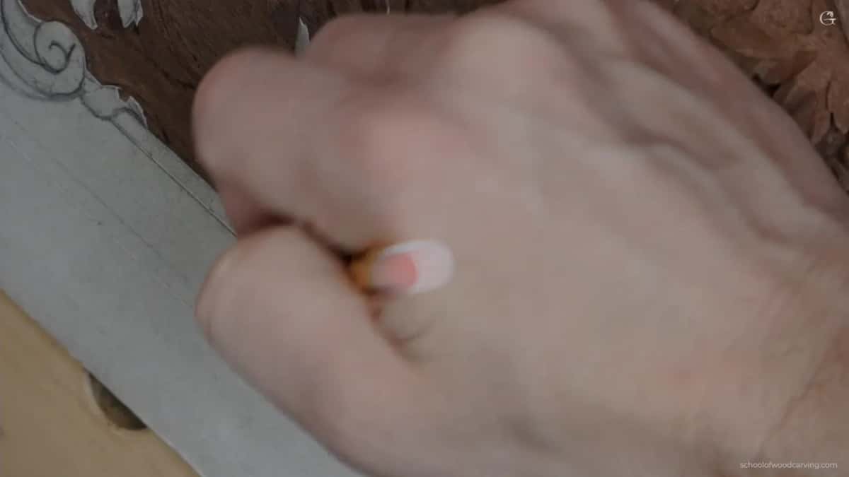 A marker moving over the design, blurred with the speed of it.