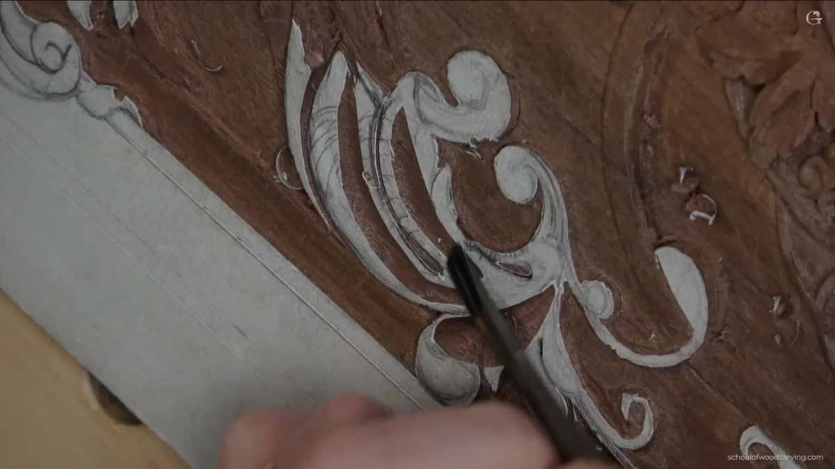 Curved steel brought down square onto the scroll, which is the habit worth breaking.