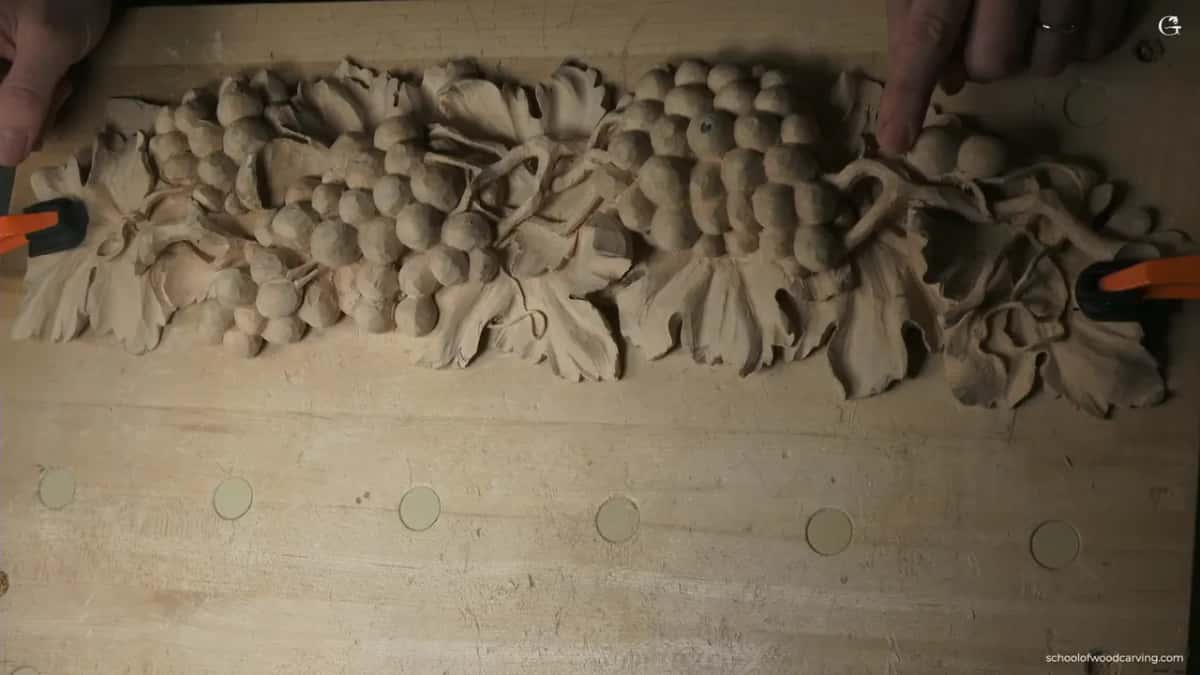 Fingertip on one grape