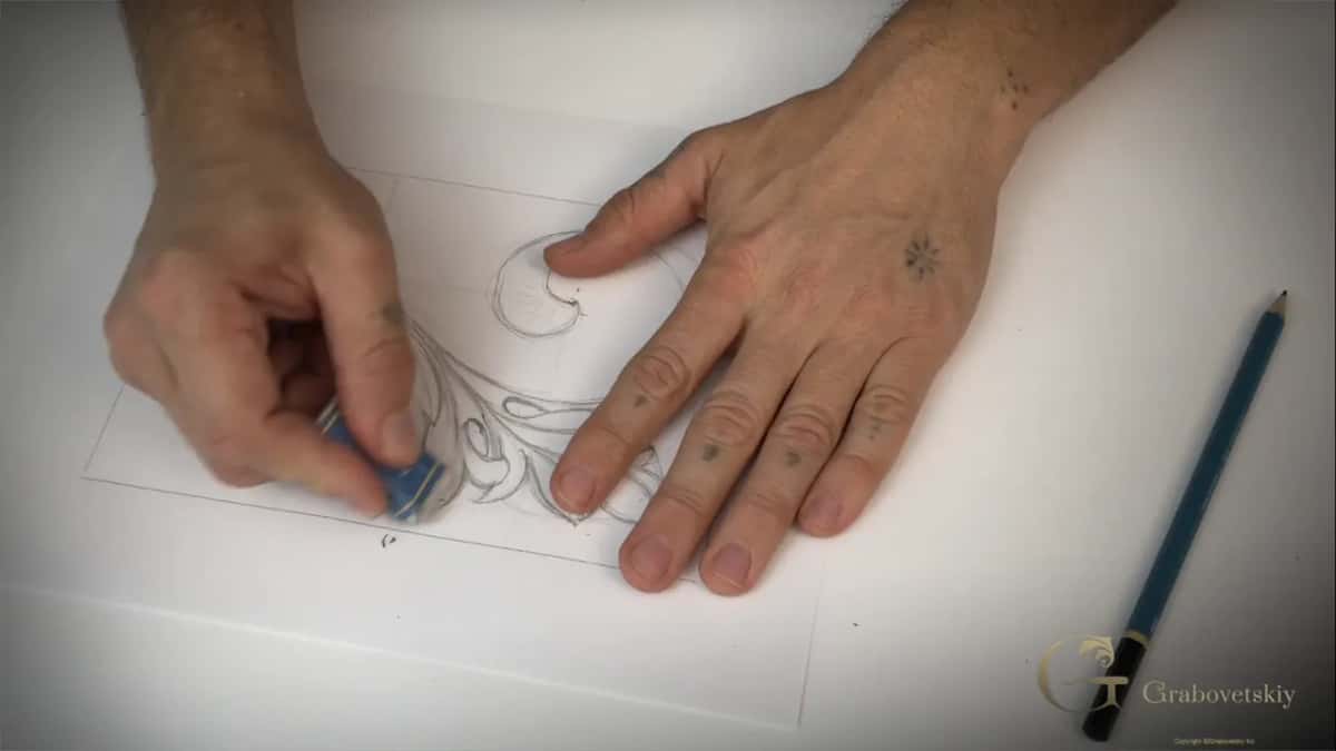 Eraser rubbing out part of the leaf