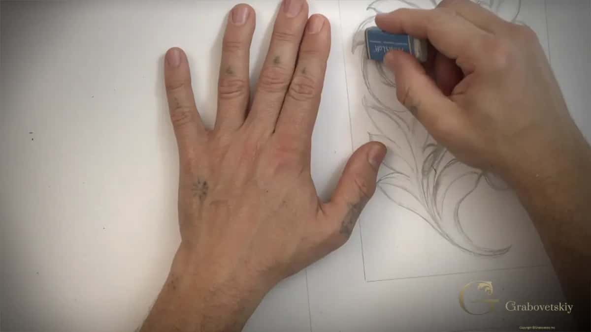 Cleaning a line up with an eraser held between finger and thumb