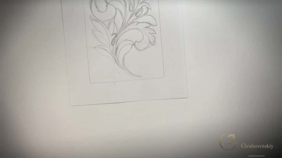 Finished Greek acanthus drawn on the sheet with both hands at the edges of it