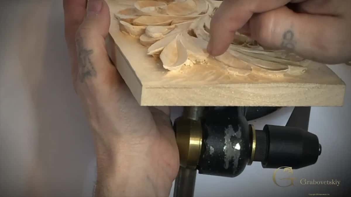 Side view of the board's thickness above a black holder