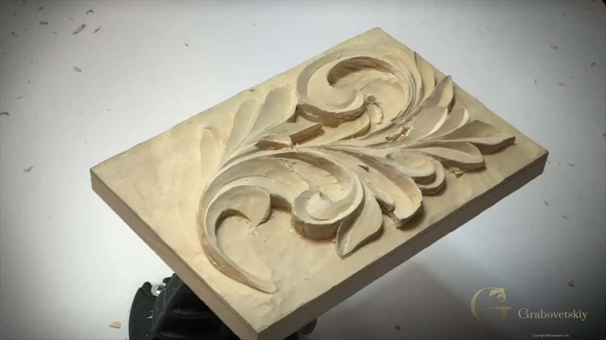 Panel with no hands near it, deep shade under the long leaf on the left