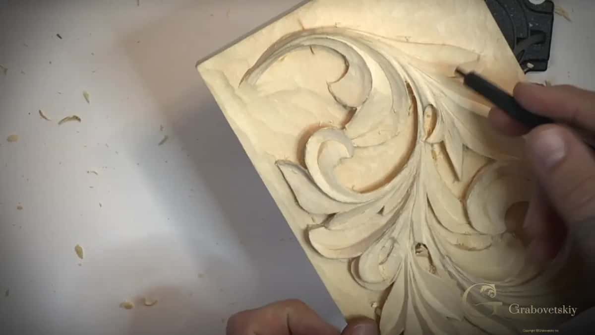 Dark handle angled over the upper right curl