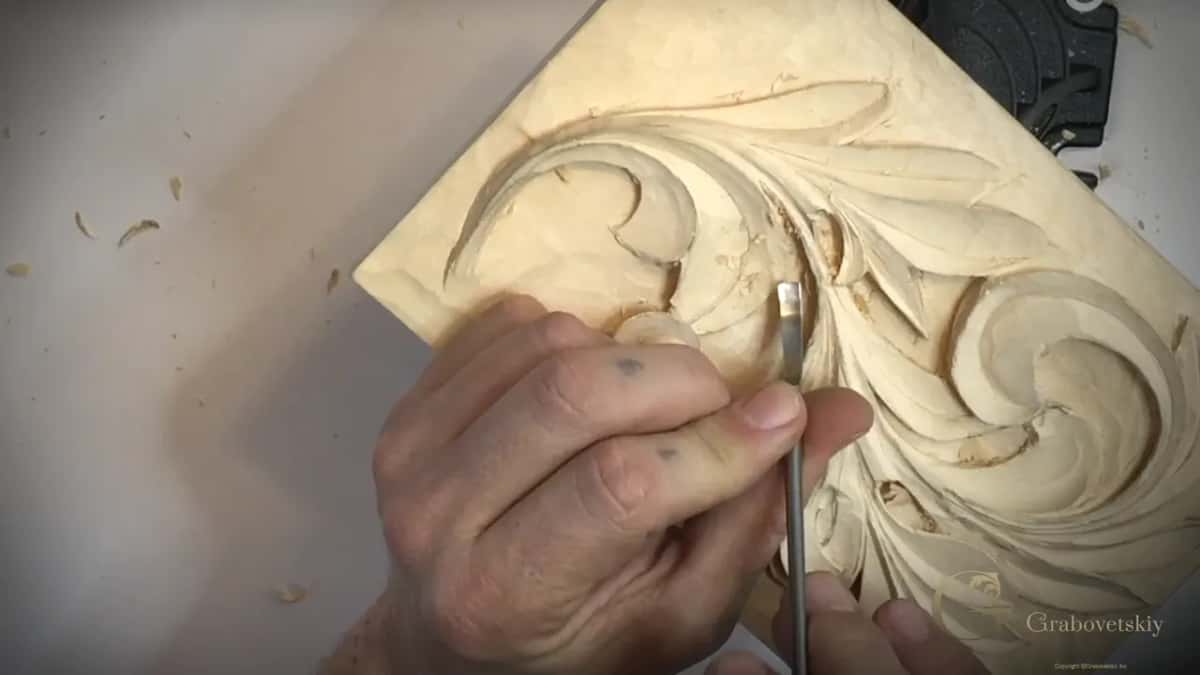 Index finger presses a narrow blade