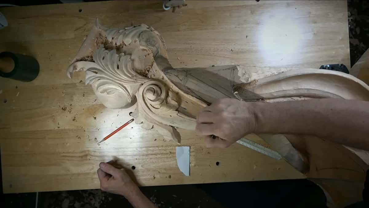 Hand resting at the scroll