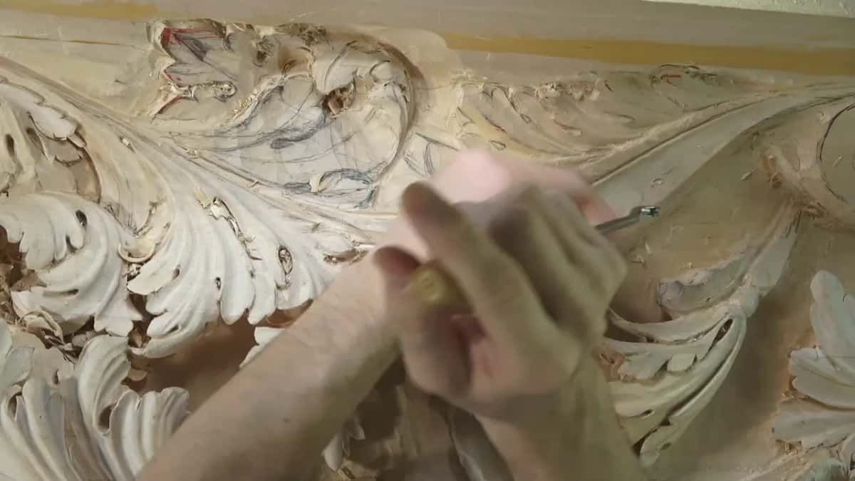 Clasped hands hide the spot.