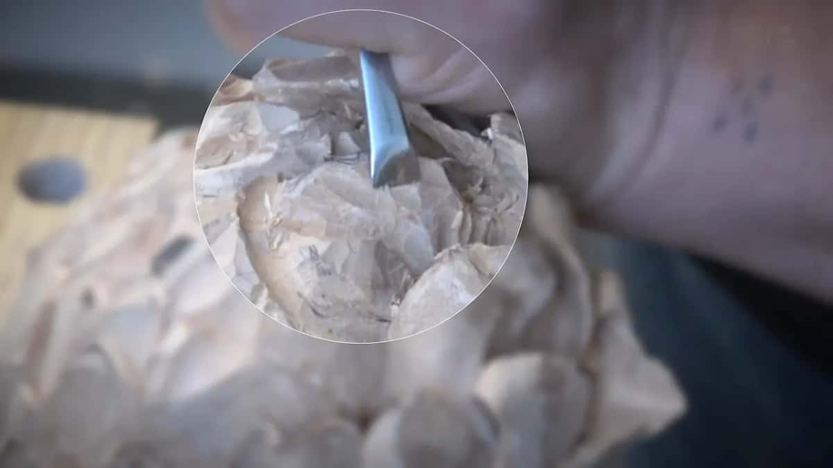 The video puts a magnifier circle over the working area, which is how small this work has become.