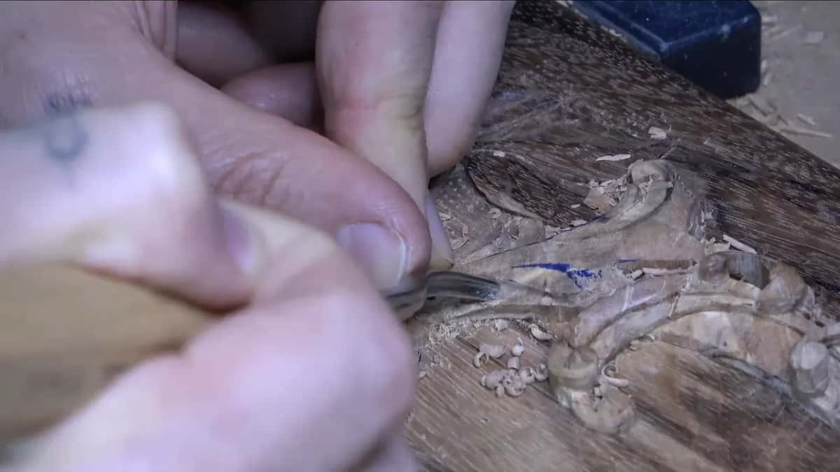 Spoon gouge undercutting beside a volute