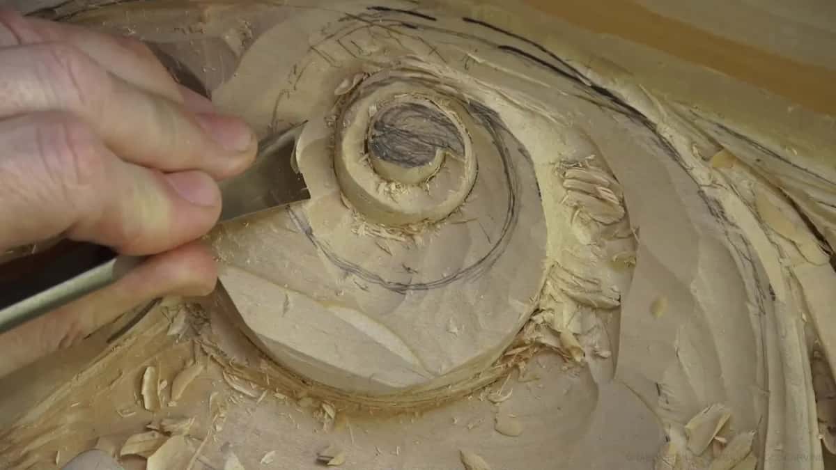 Fingertips near the pencil core.