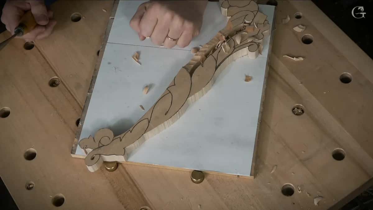 One hand flat on the board throughout.