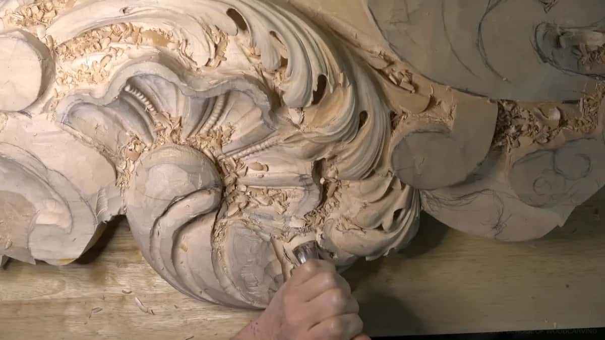 Knuckles and a short blade dig into the hollow beside the shell.