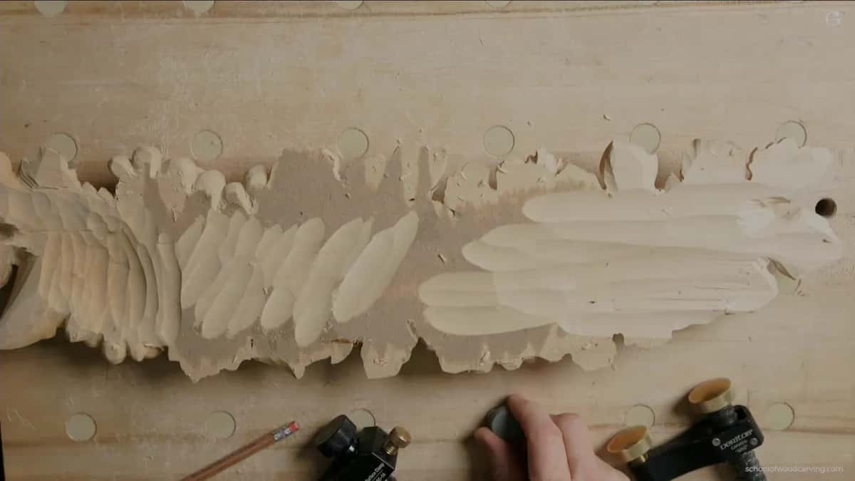 Clamps on the bench beside the turned panel