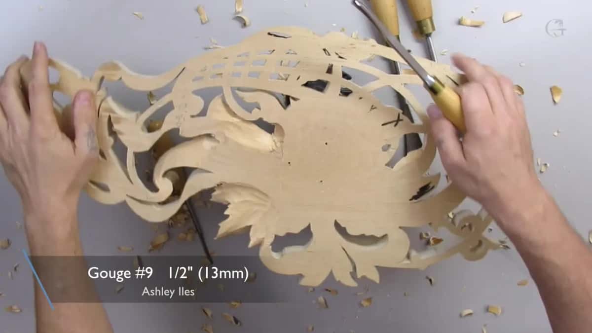 Caption for a number 9 gouge at 1/2 inch (13 mm), one hand on the panel and the other on the handle
