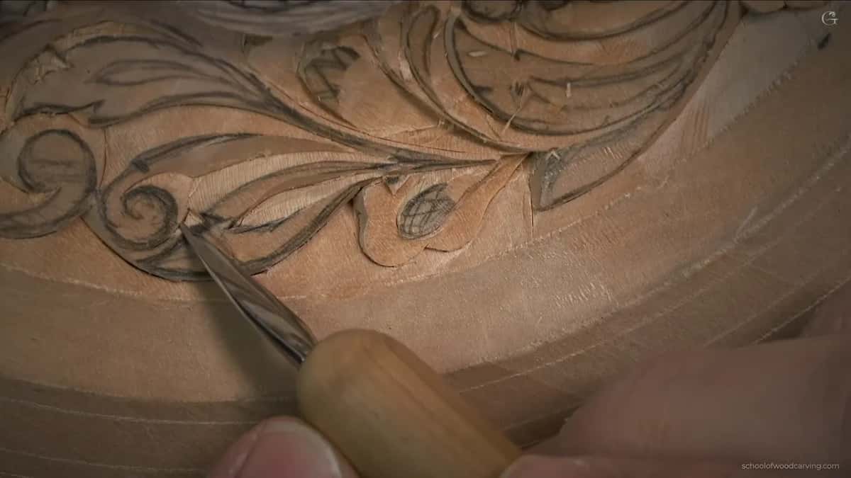 Knife tip working along a long leaf by the border