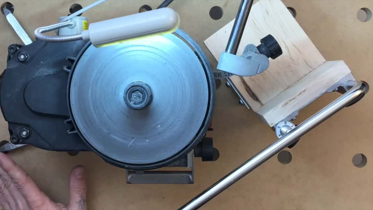 Lamp lit over the bare grinding disc.