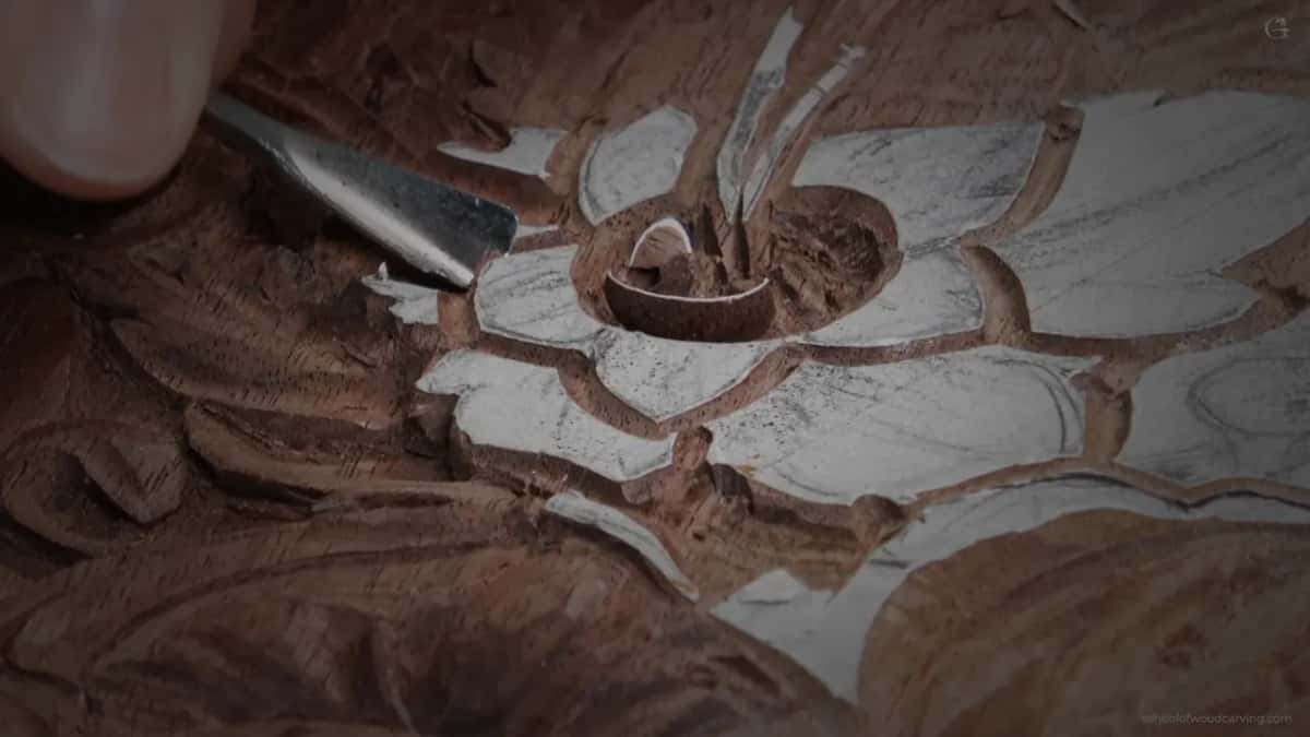 Bright steel laid into the hollowed heart of the flower.