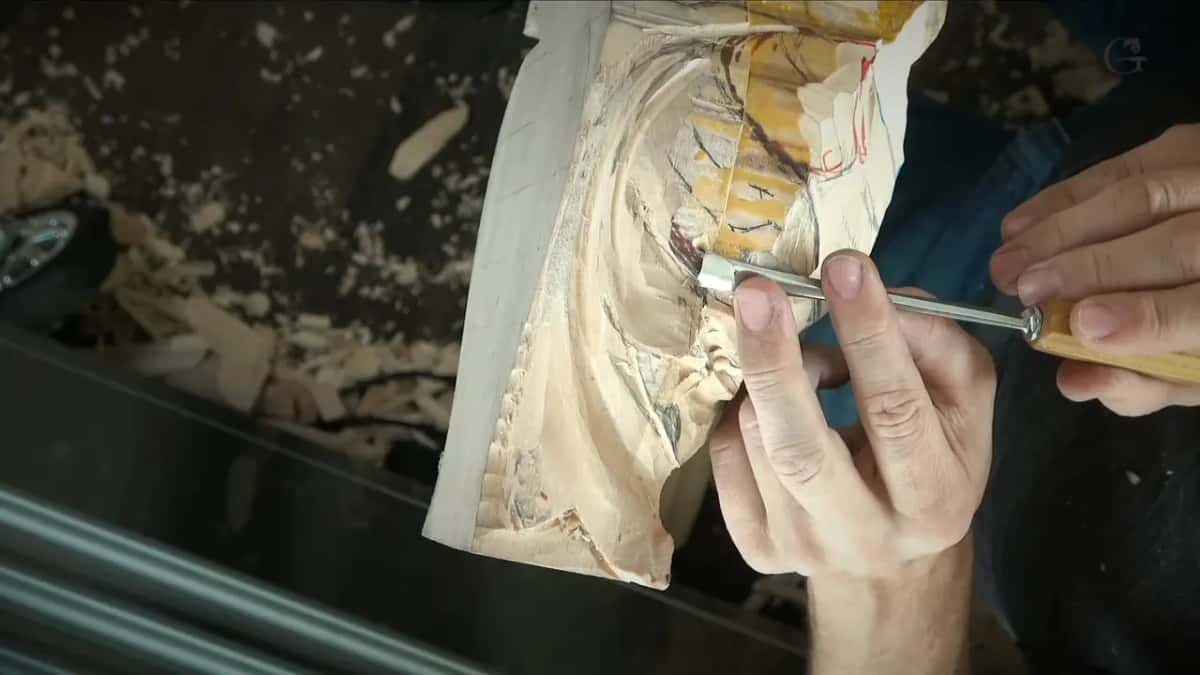 A gouge turned so its long, flat bevel faces the camera, over the side