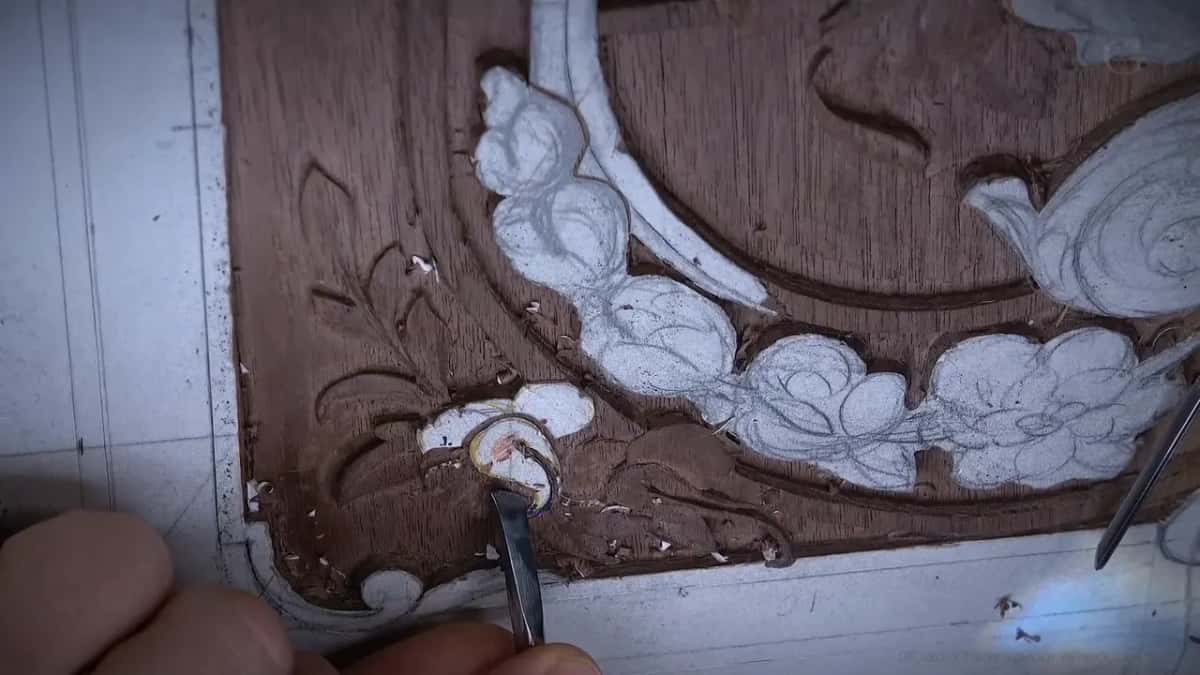 Heel of the blade down on the little flower, a second tool resting over at the right
