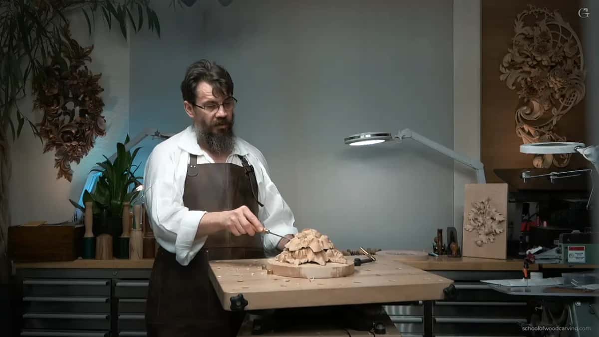 Working alone at the bench, the piece clamped to a round board, and nobody in the room waiting for the next instruction