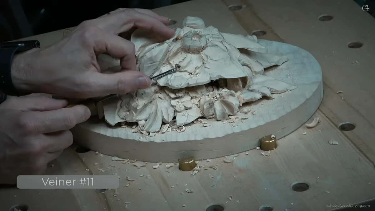 Veiner working the wood down around an opening