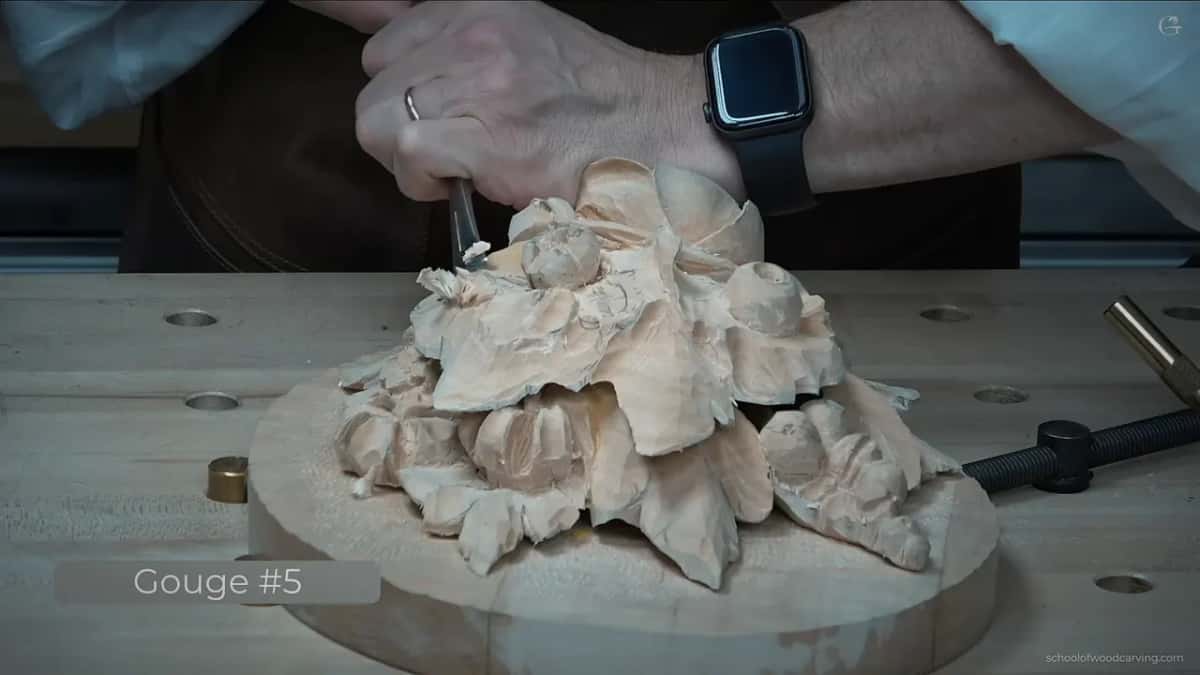 Gouge going in, with the video's own caption naming the tool in the corner of the frame