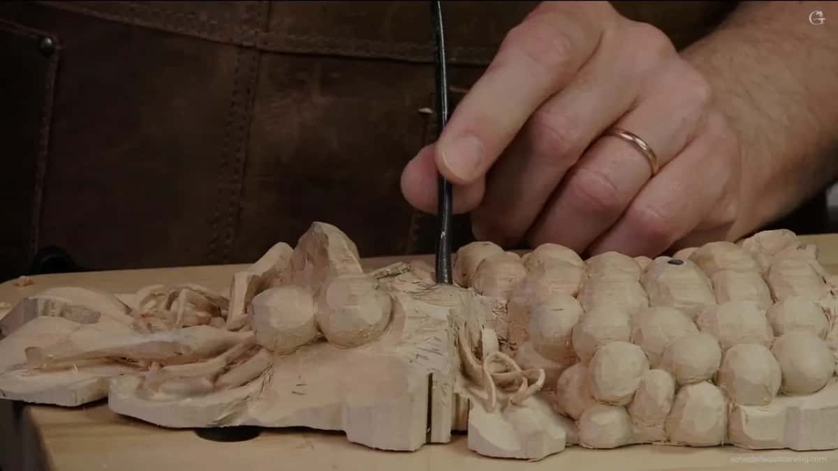 Back bend going in beneath an overhang, its handle out in clear air where a hand can hold it