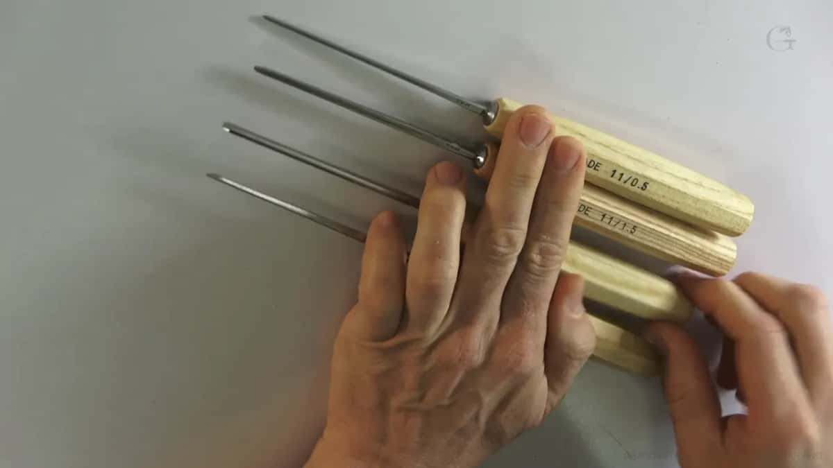 Same tools from a lower angle, the blades no thicker than a needle.