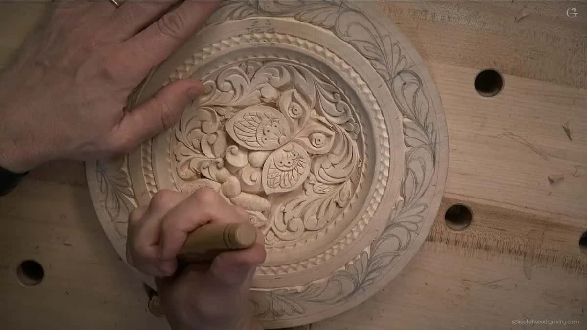 Knife low in the band, pale handle toward the camera, other hand on the center