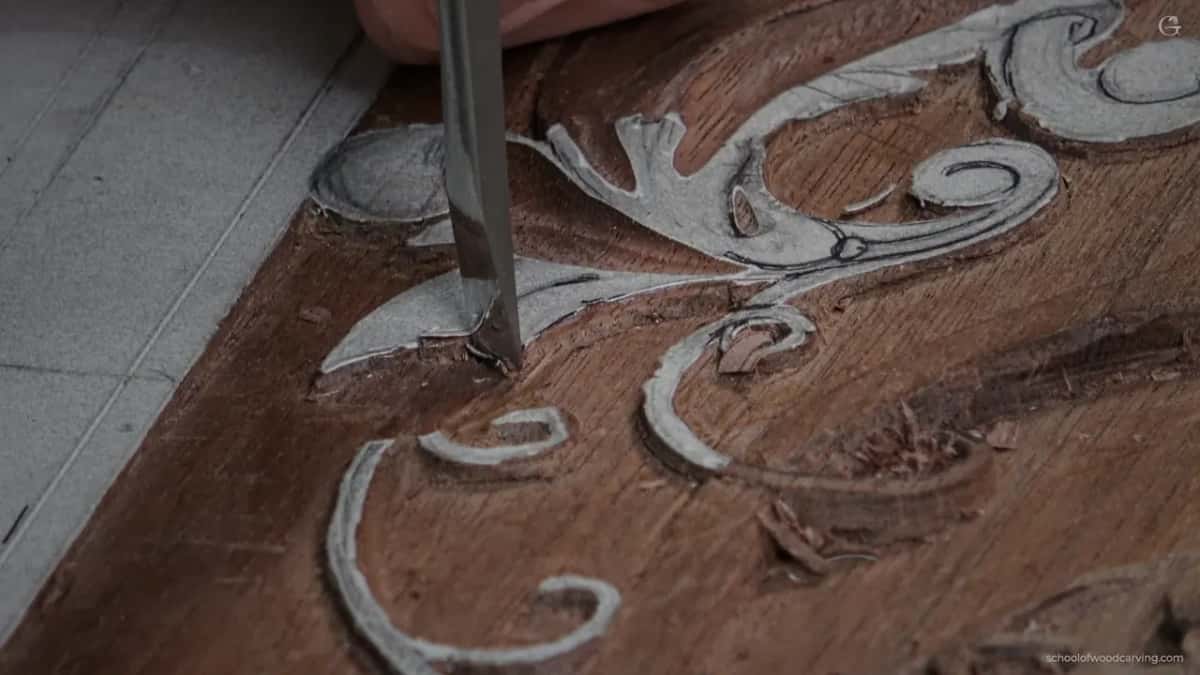 Steel driven down at the scroll, exactly the cut that goes one step too far.