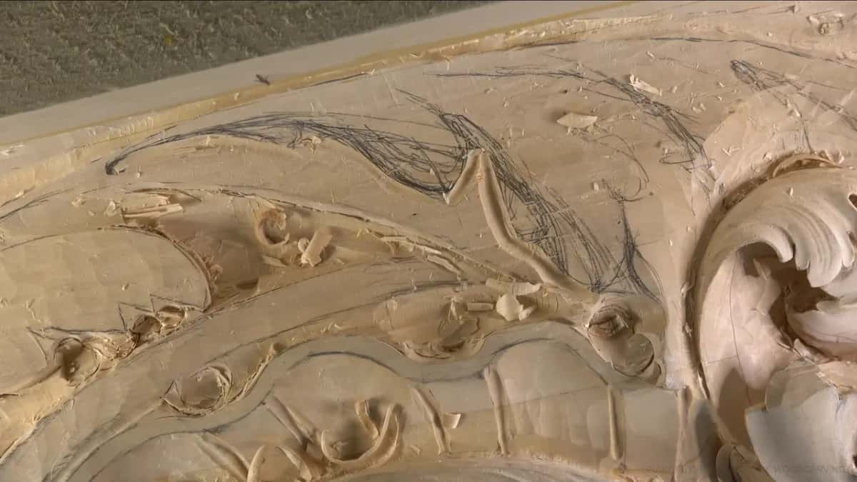 Drawn on the rough Pencil layout drawn straight onto roughed wood, with a single finished acanthus curl standing complete at the edge