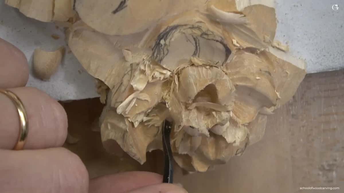 Spoon gouge softening hard edges inside the flower.