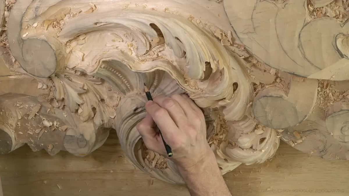 Pencil tip on the rounded band below the shell.