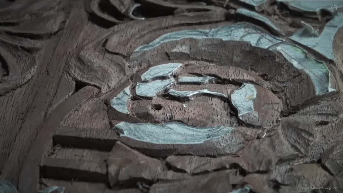 Carving alone in the frame, cool light, every petal chalked and the ground left dark.